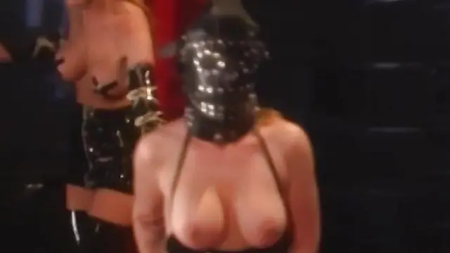 Kinky dominatrix uses sex toys on masked girl in latex suit