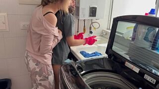 Two women locked in heated kitchen intimacy without a sound
