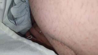 Stepmom discreetly gives stepson a handjob under the covers