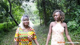 Blazing ebony babes get wild on the festival grounds, raw kissing and grinding at dusk